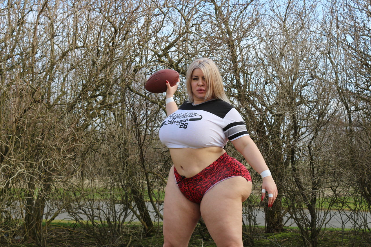 Curvaceous football player Natasha Crown flaunts her huge ass outdoors  